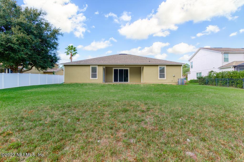 126 Arabian Court St. Augustine, FL 32095 - Photo 26 of 62 a view of a house with a yard and a garage