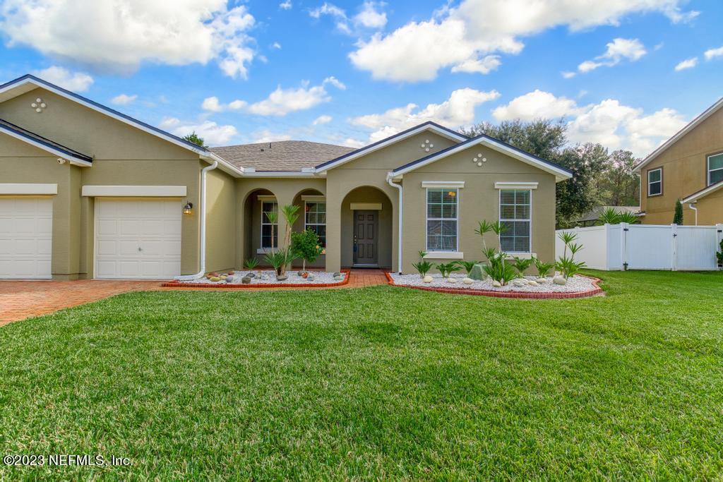 126 Arabian Court St. Augustine, FL 32095 - Photo 30 of 62 a front view of house with yard and green space