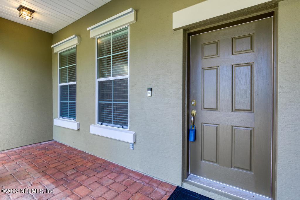 126 Arabian Court St. Augustine, FL 32095 - Photo 32 of 62 a view of an empty room with wooden floor and a window