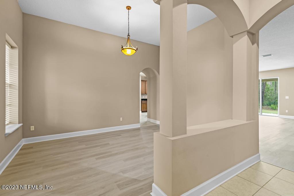 126 Arabian Court St. Augustine, FL 32095 - Photo 34 of 62 a view of an empty room with window and wooden floor