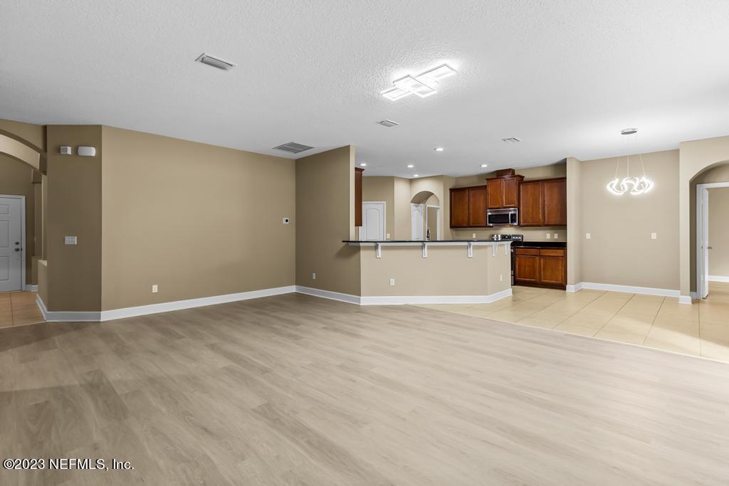 126 Arabian Court St. Augustine, FL 32095 - Photo 38 of 62 a view of a kitchen with a sink and a refrigerator