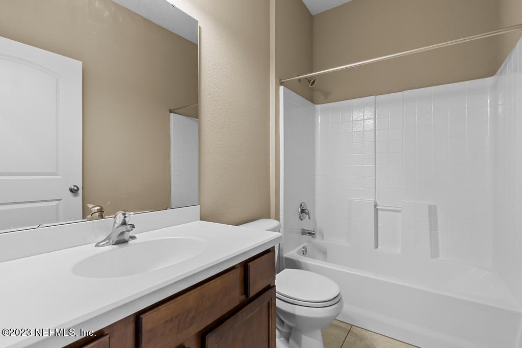126 Arabian Court St. Augustine, FL 32095 - Photo 46 of 62 a bathroom with a sink and a mirror