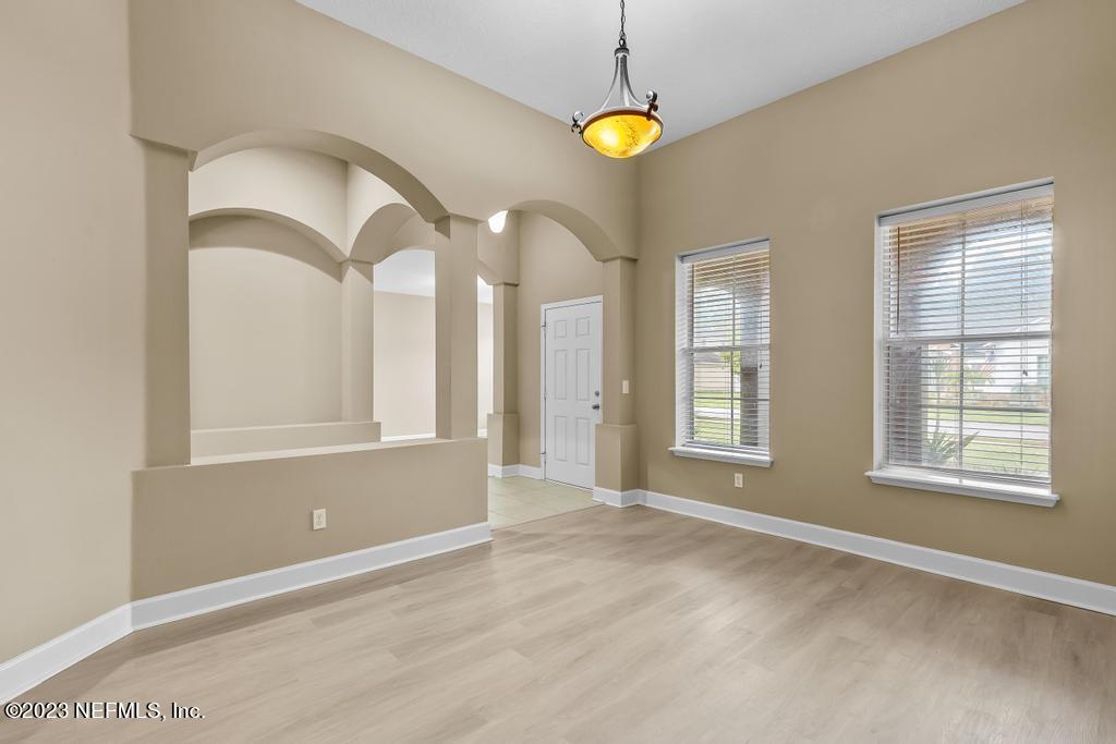 126 Arabian Court St. Augustine, FL 32095 - Photo 5 of 62 a view of an empty room with window and chandelier