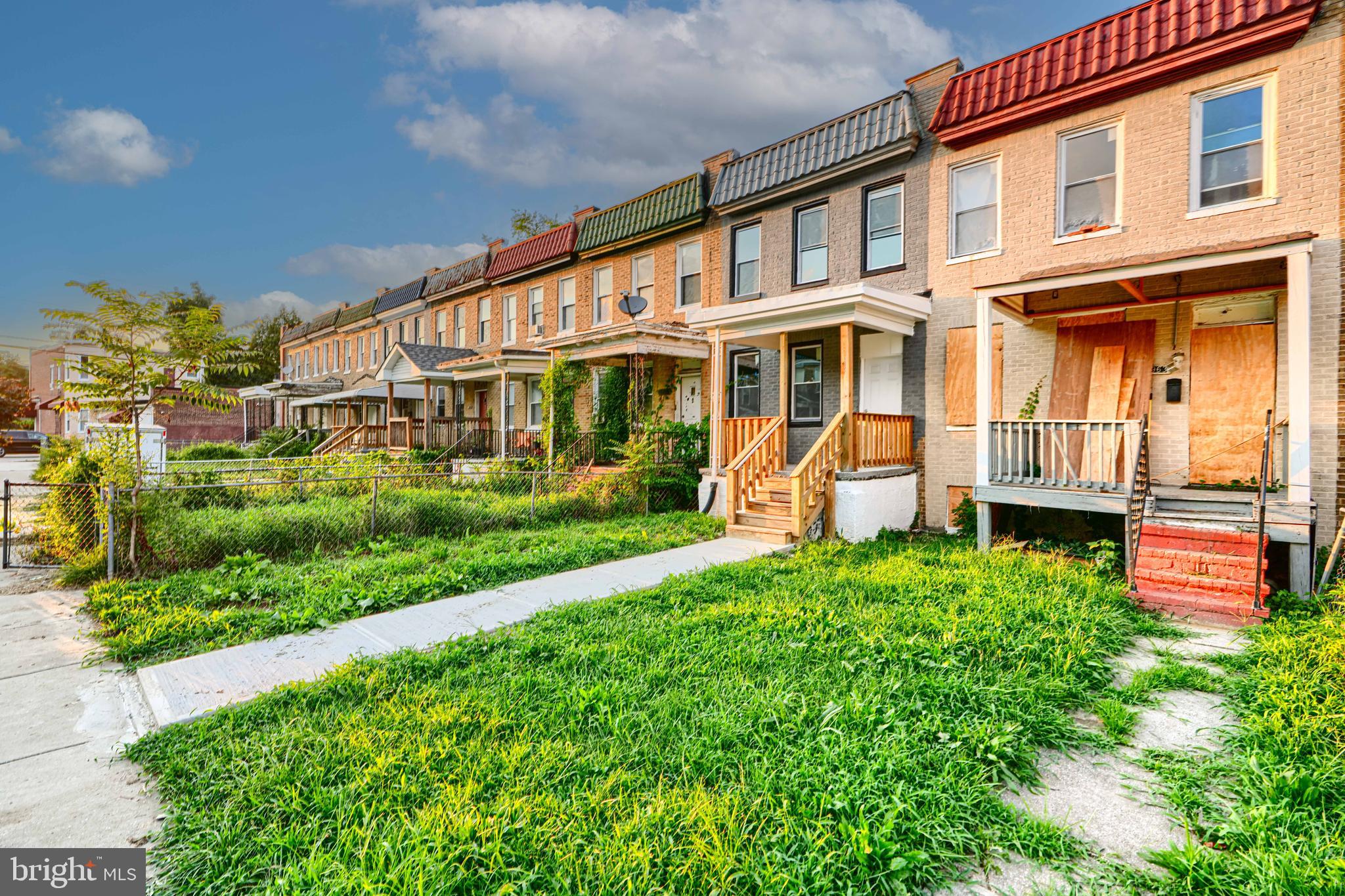 4963 Edgemere Avenue Baltimore, MD 21215 - Photo 2 of 3 front view of a house with a yard