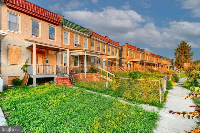 front view of a building with a yard