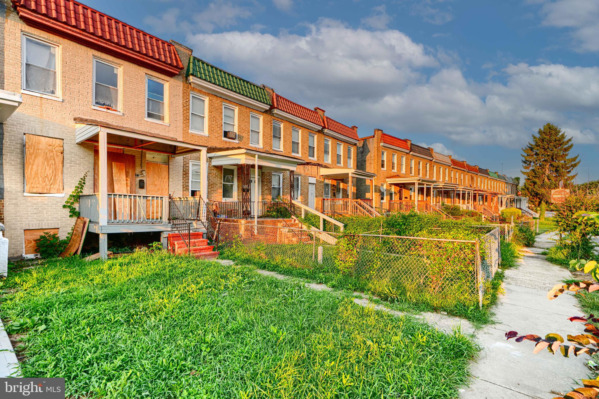 4963 Edgemere Avenue Baltimore, MD 21215 - Photo 3 of 3 front view of a building with a yard