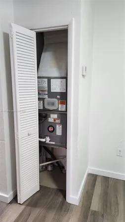 a view of utility room and bedroom