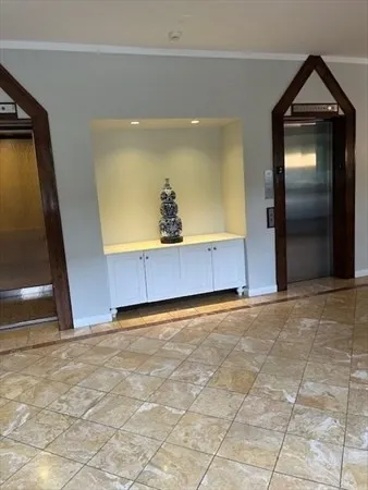 a view of an empty room and a window