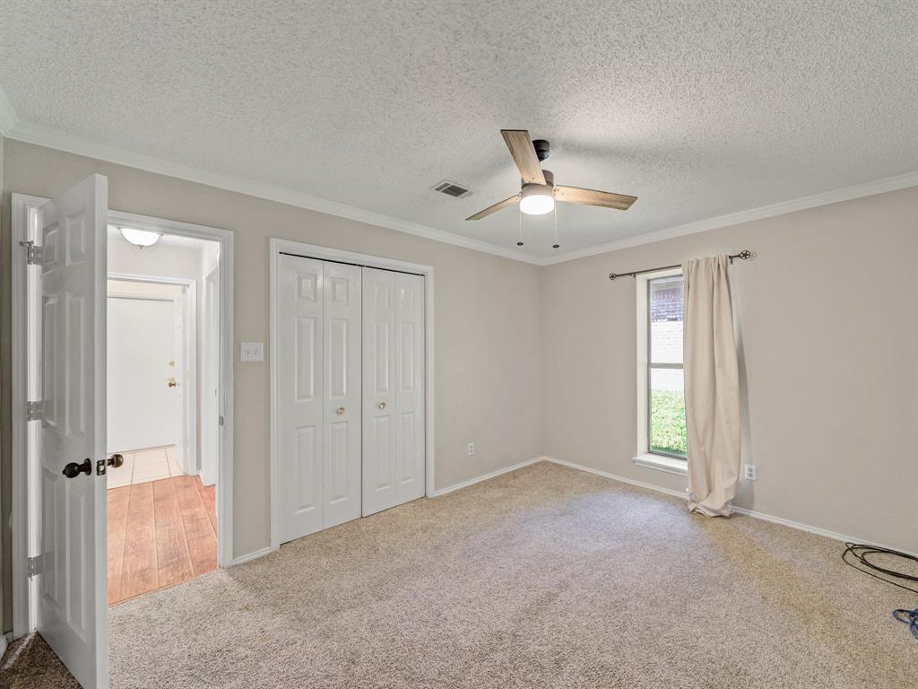 121 Northeast Brushy Mound Road Burleson, TX 76028 - Photo 20 of 35 a view of a big room with windows and closet area
