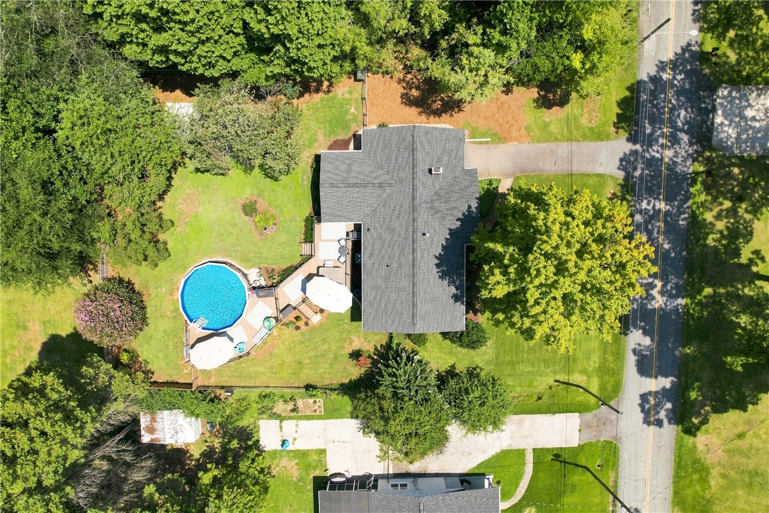 204 Sylvia Road Easley, SC 29642 - Photo 35 of 36 An aerial perspective reveals a private above-ground pool and an expansive yard, ready for summer relaxation.