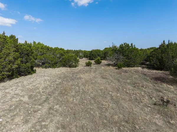 a view of a lake with mountain in background