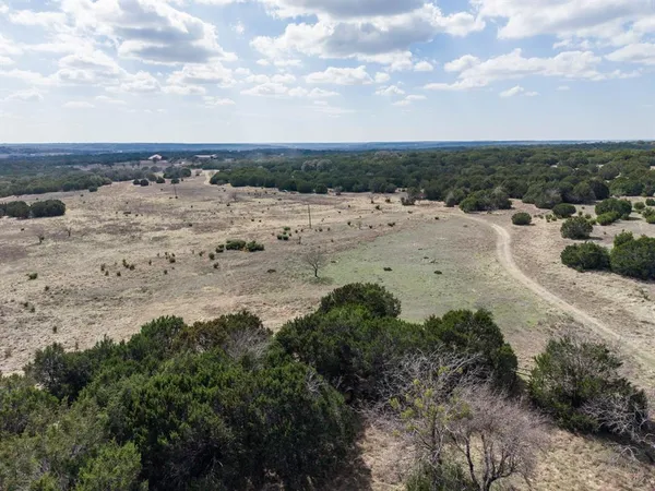 a view of a wooden house with an outdoor space