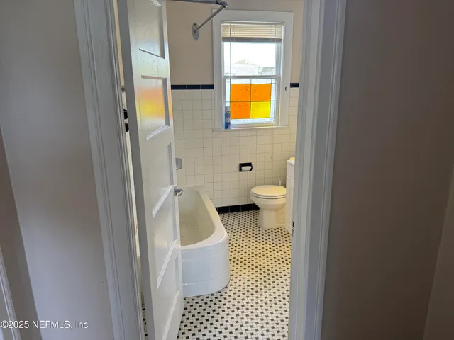 a bathroom with a toilet and a sink