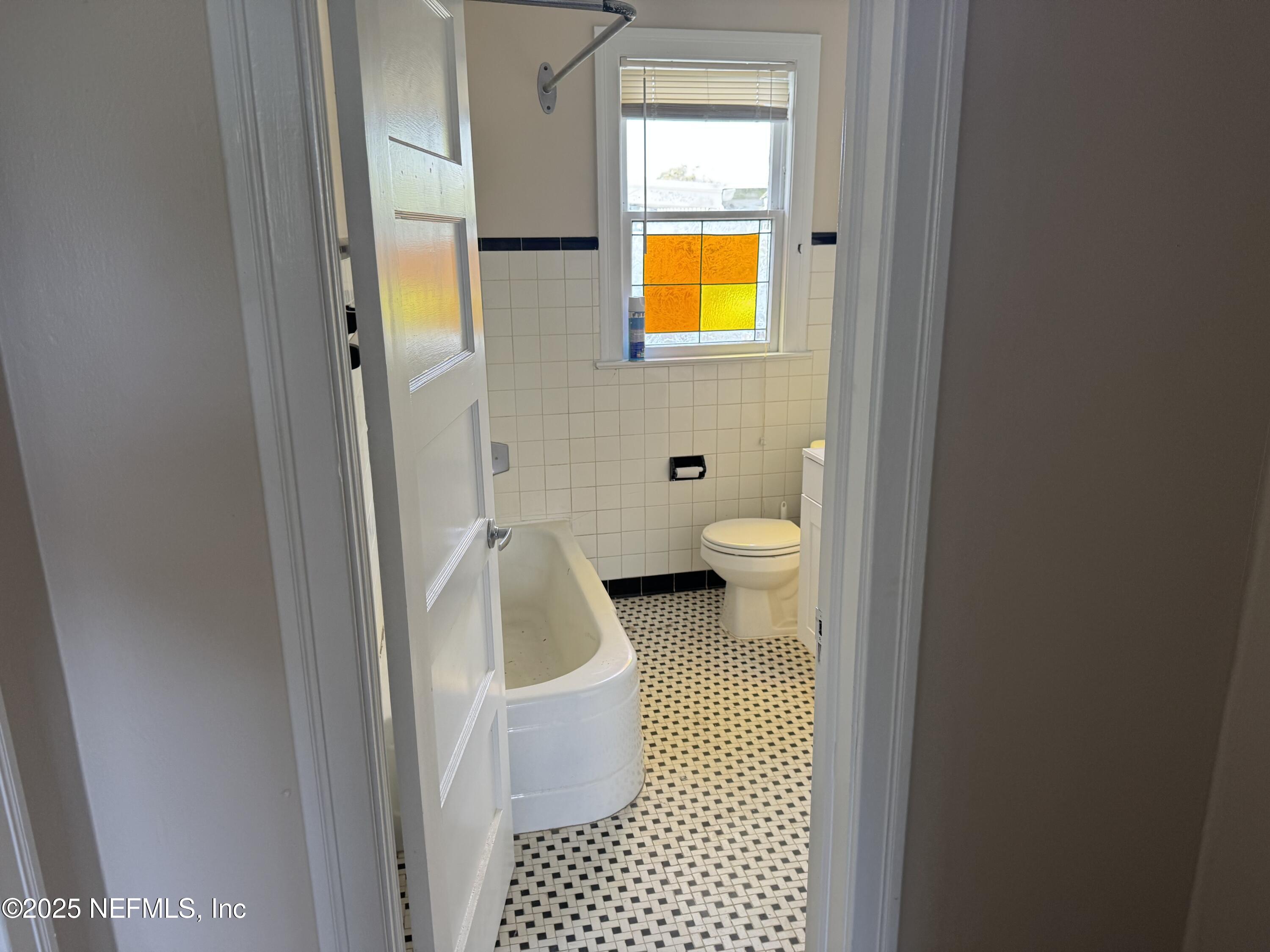 300 Bay Street Neptune Beach, FL 32266 - Photo 12 of 12 a bathroom with a toilet and a sink