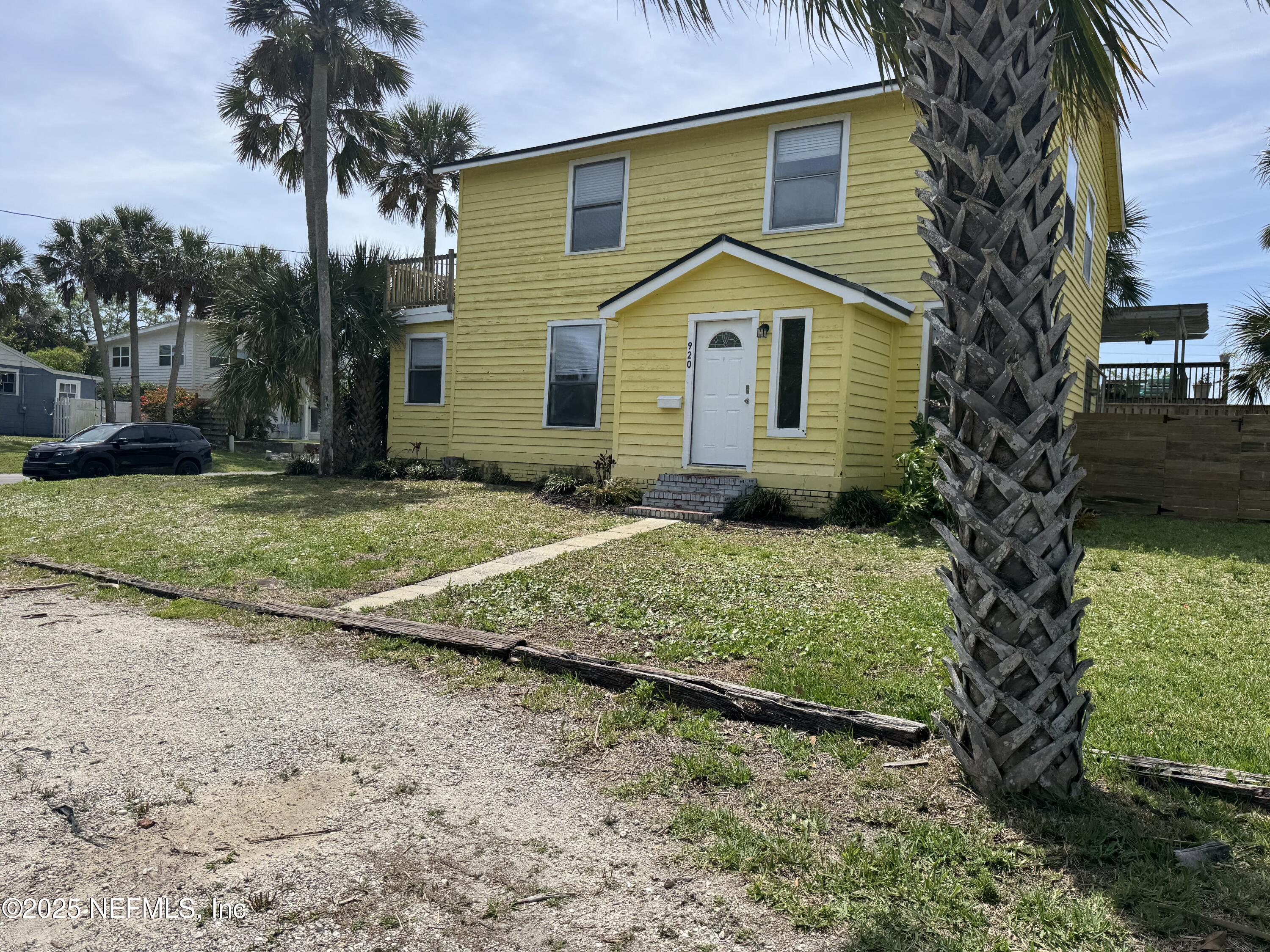 300 Bay Street Neptune Beach, FL 32266 - Photo 5 of 12 a front view of a house with a yard and garage