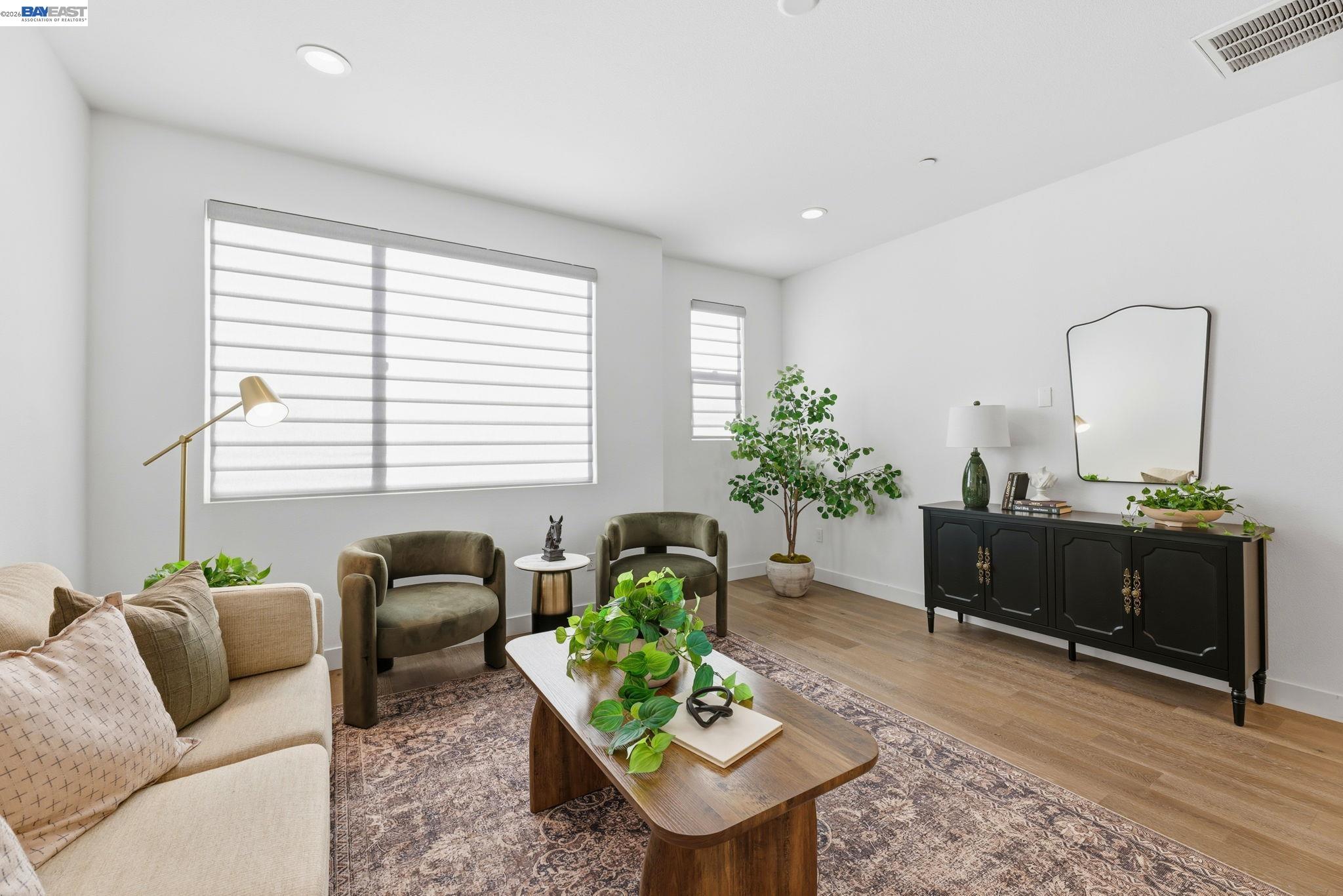 931 Edy Lane Oakland, CA 94607 - Photo 11 of 41 a living room with furniture plant and a window