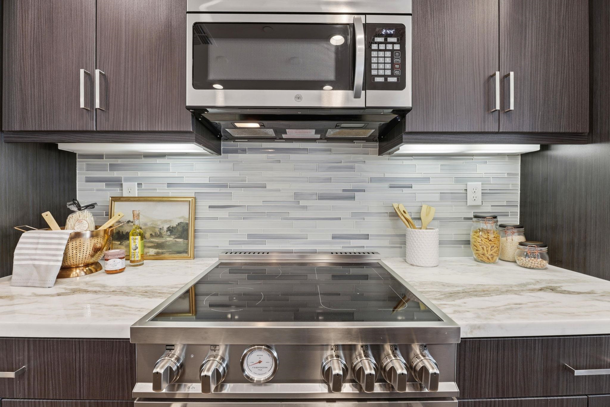931 Edy Lane Oakland, CA 94607 - Photo 12 of 41 a kitchen with stove top oven and cabinets