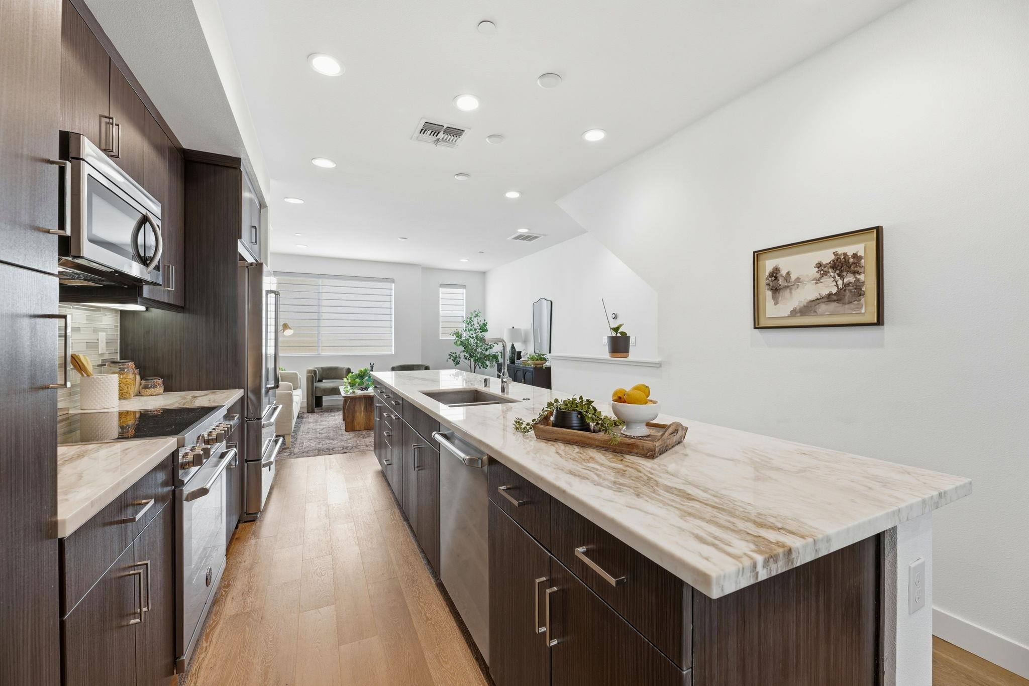 931 Edy Lane Oakland, CA 94607 - Photo 13 of 41 a kitchen with stainless steel appliances granite countertop a stove a sink dishwasher and a refrigerator