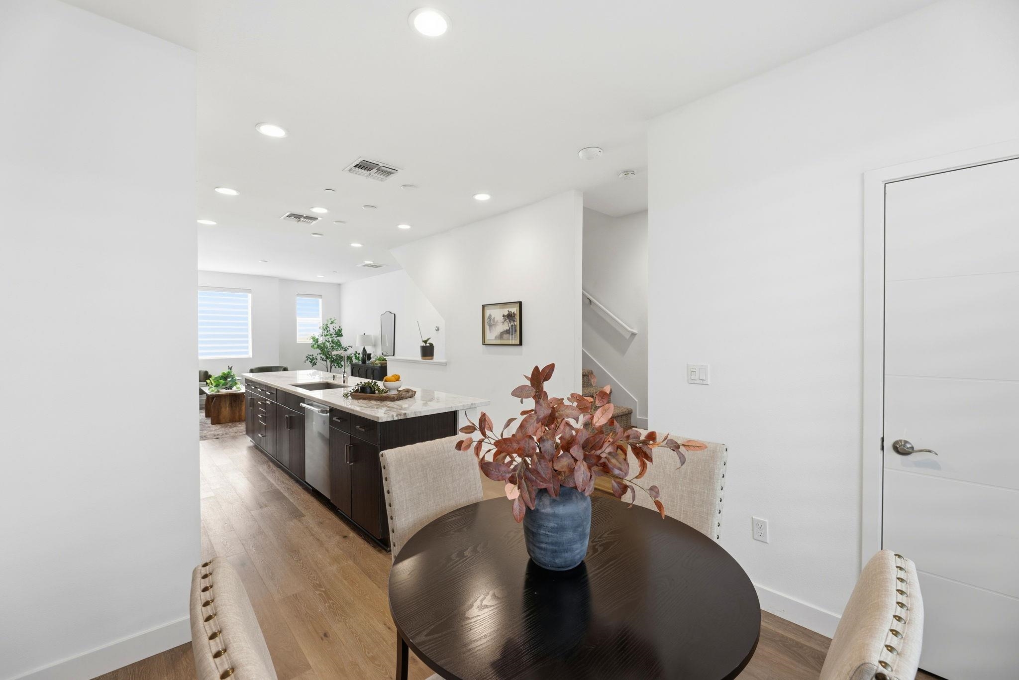 931 Edy Lane Oakland, CA 94607 - Photo 19 of 41 a living room with stainless steel appliances kitchen island a table and chairs in it