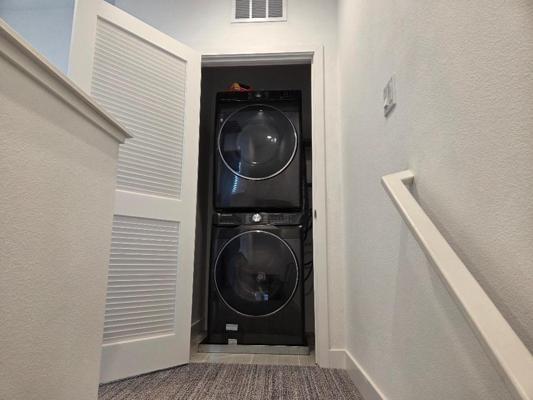 931 Edy Lane Oakland, CA 94607 - Photo 22 of 41 a view of a hallway with washer and dryer