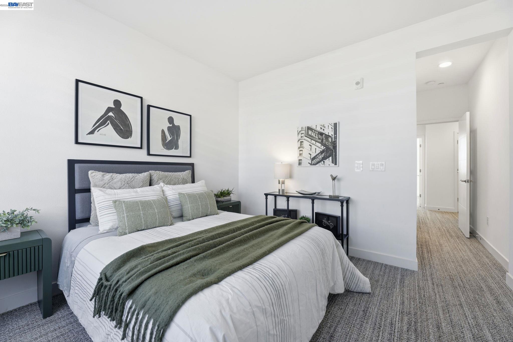 931 Edy Lane Oakland, CA 94607 - Photo 26 of 41 a bedroom with a bed and painting on the wall