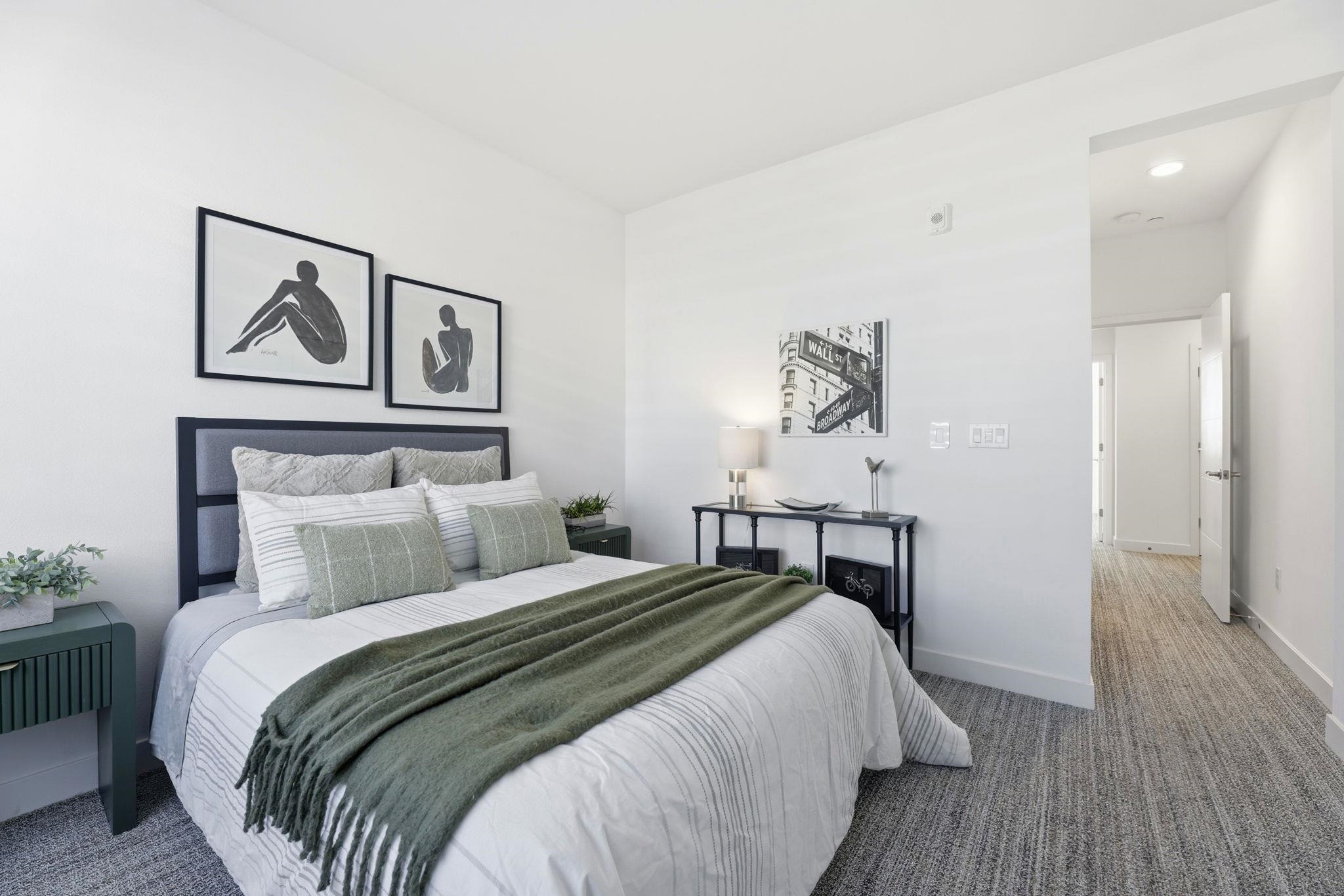 931 Edy Lane Oakland, CA 94607 - Photo 28 of 41 a bedroom with a bed and painting on the wall