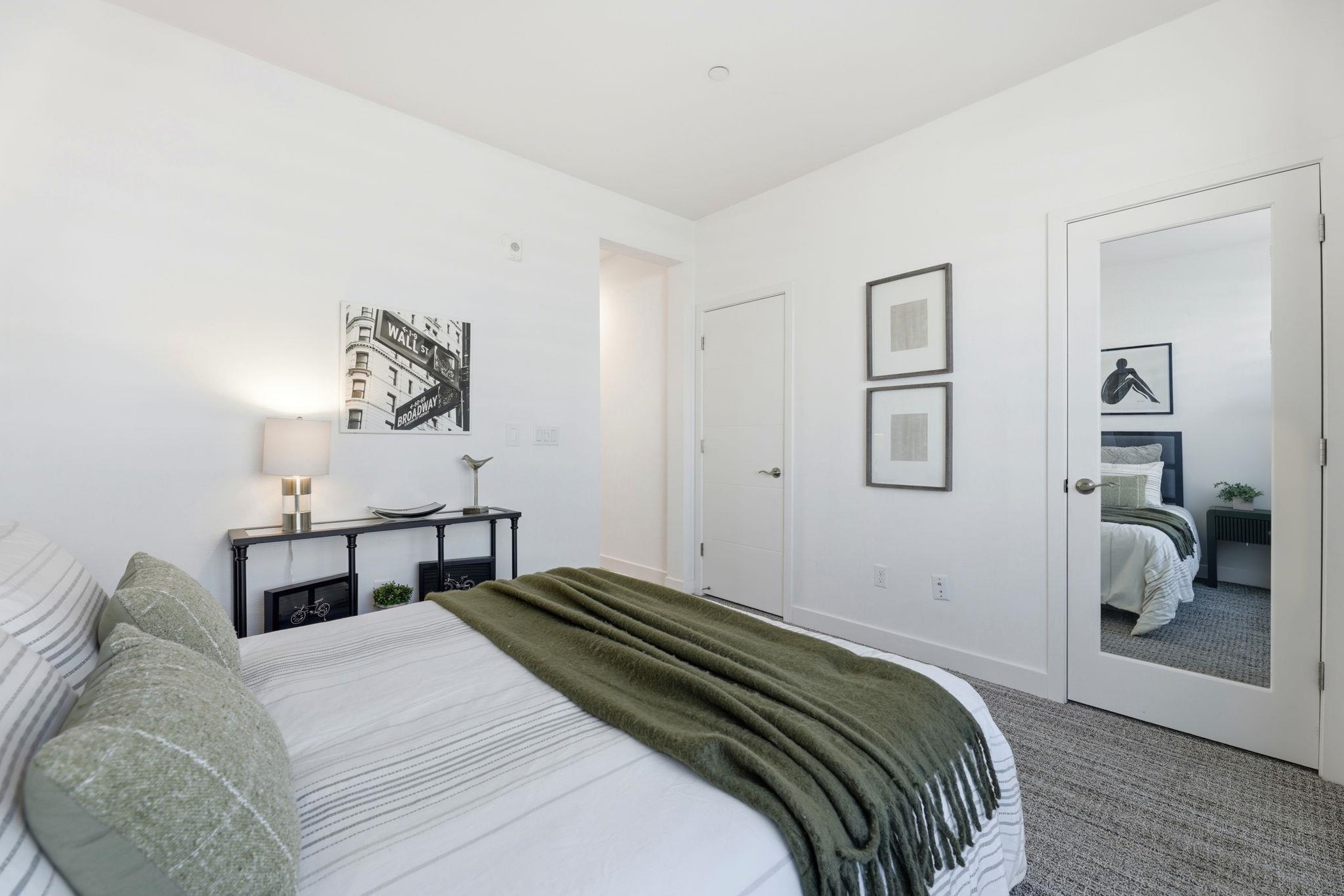 931 Edy Lane Oakland, CA 94607 - Photo 29 of 41 a bedroom with a bed and a table