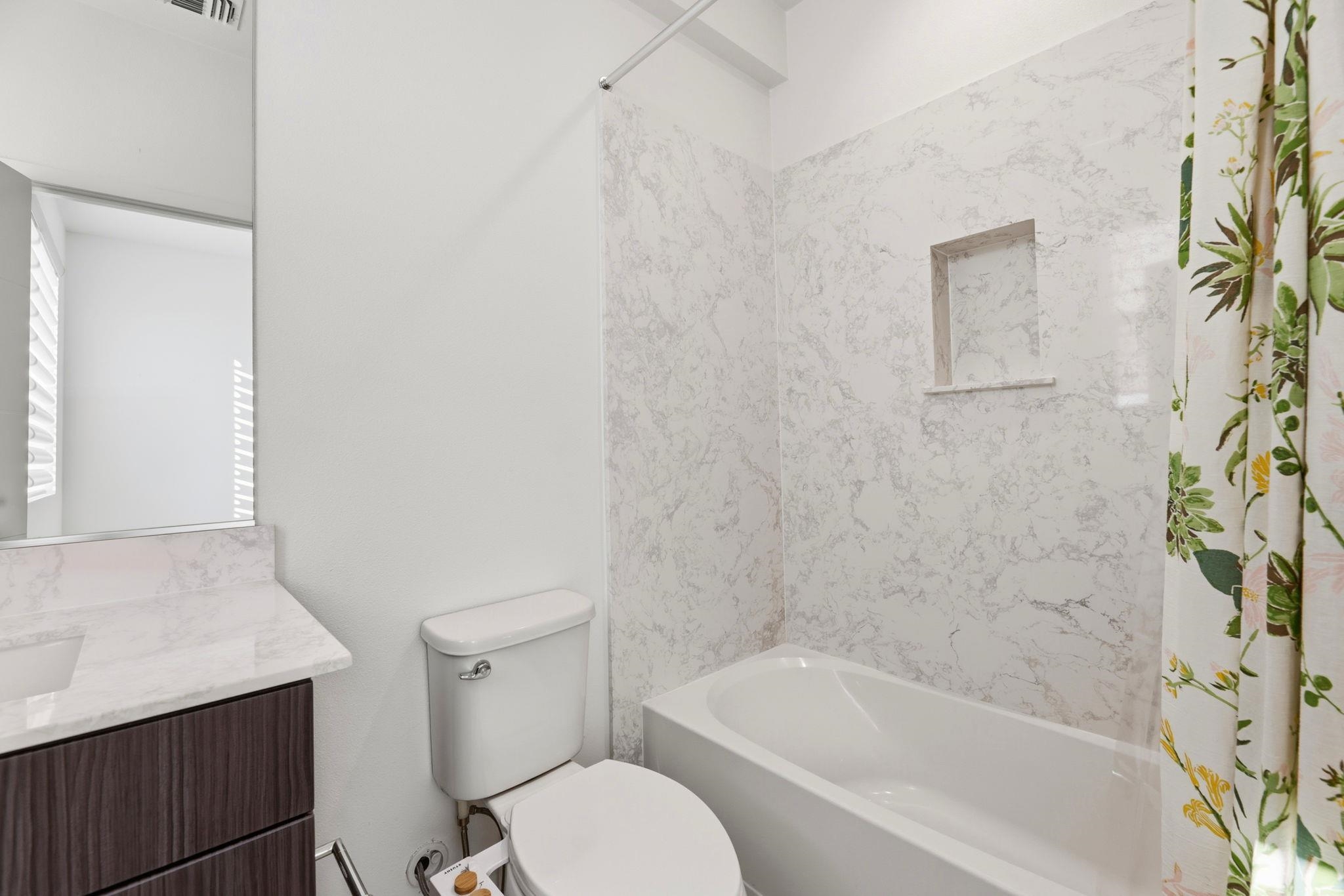 931 Edy Lane Oakland, CA 94607 - Photo 31 of 41 a white bath tub sitting next to a white toilet