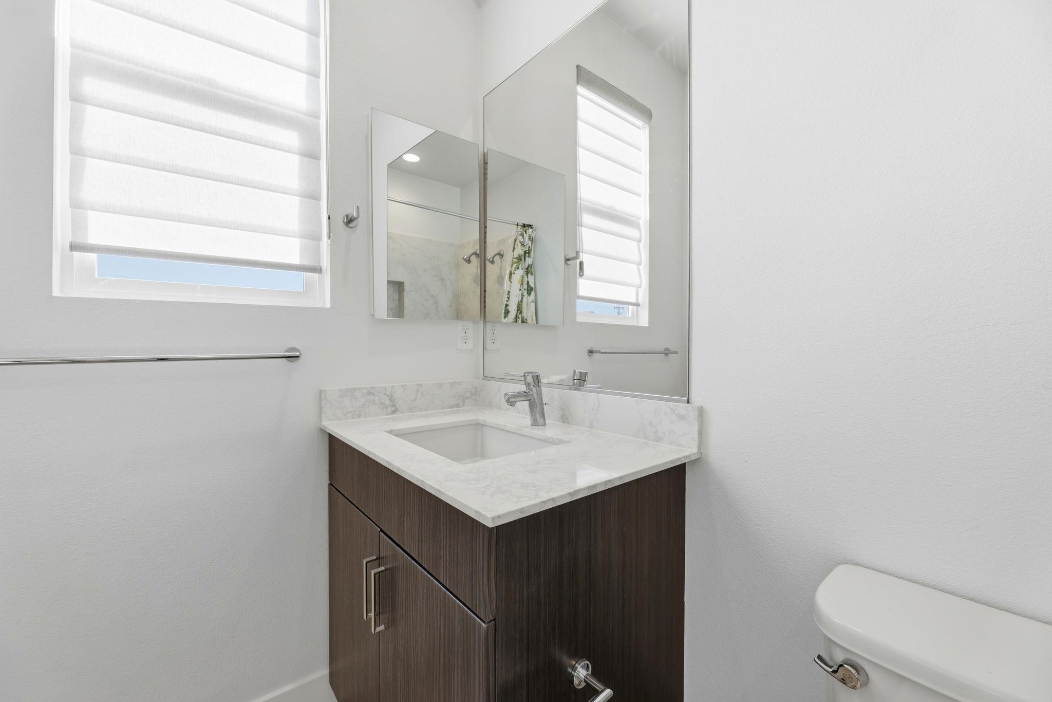931 Edy Lane Oakland, CA 94607 - Photo 32 of 41 a bathroom with a sink toilet and mirror