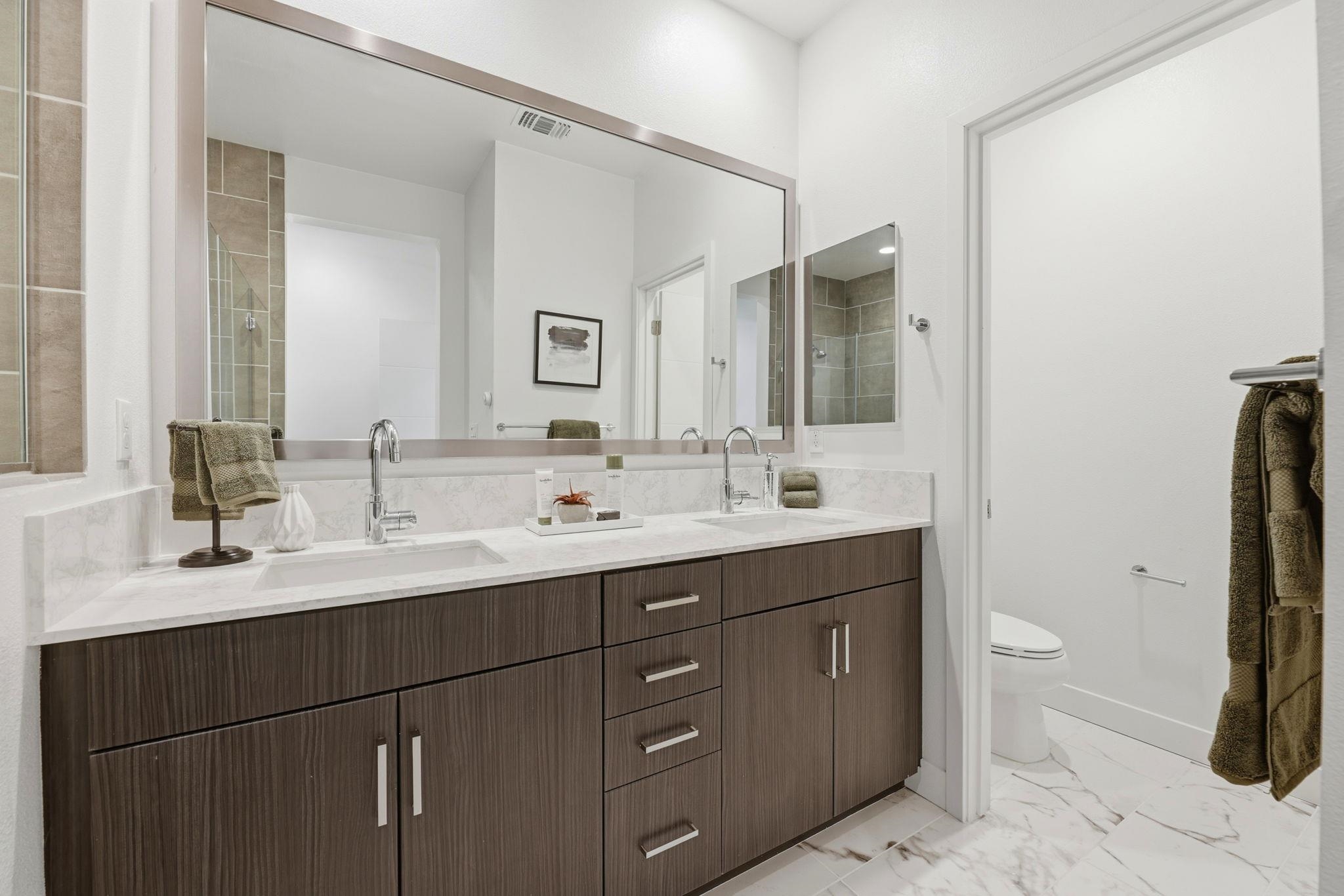 931 Edy Lane Oakland, CA 94607 - Photo 35 of 41 a bathroom with a double vanity sink and mirror