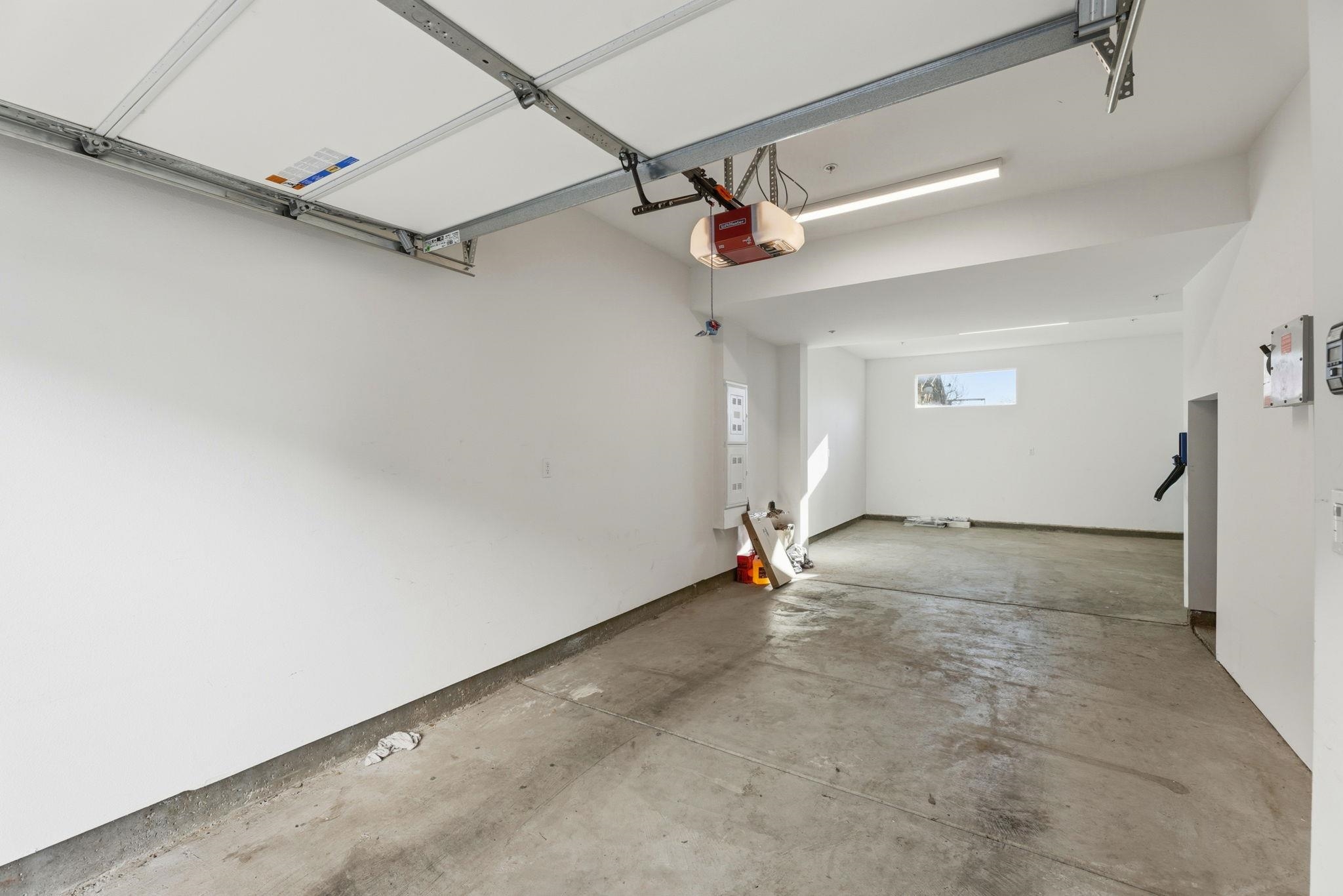 931 Edy Lane Oakland, CA 94607 - Photo 38 of 41 an empty room with a ceiling fan and carpet
