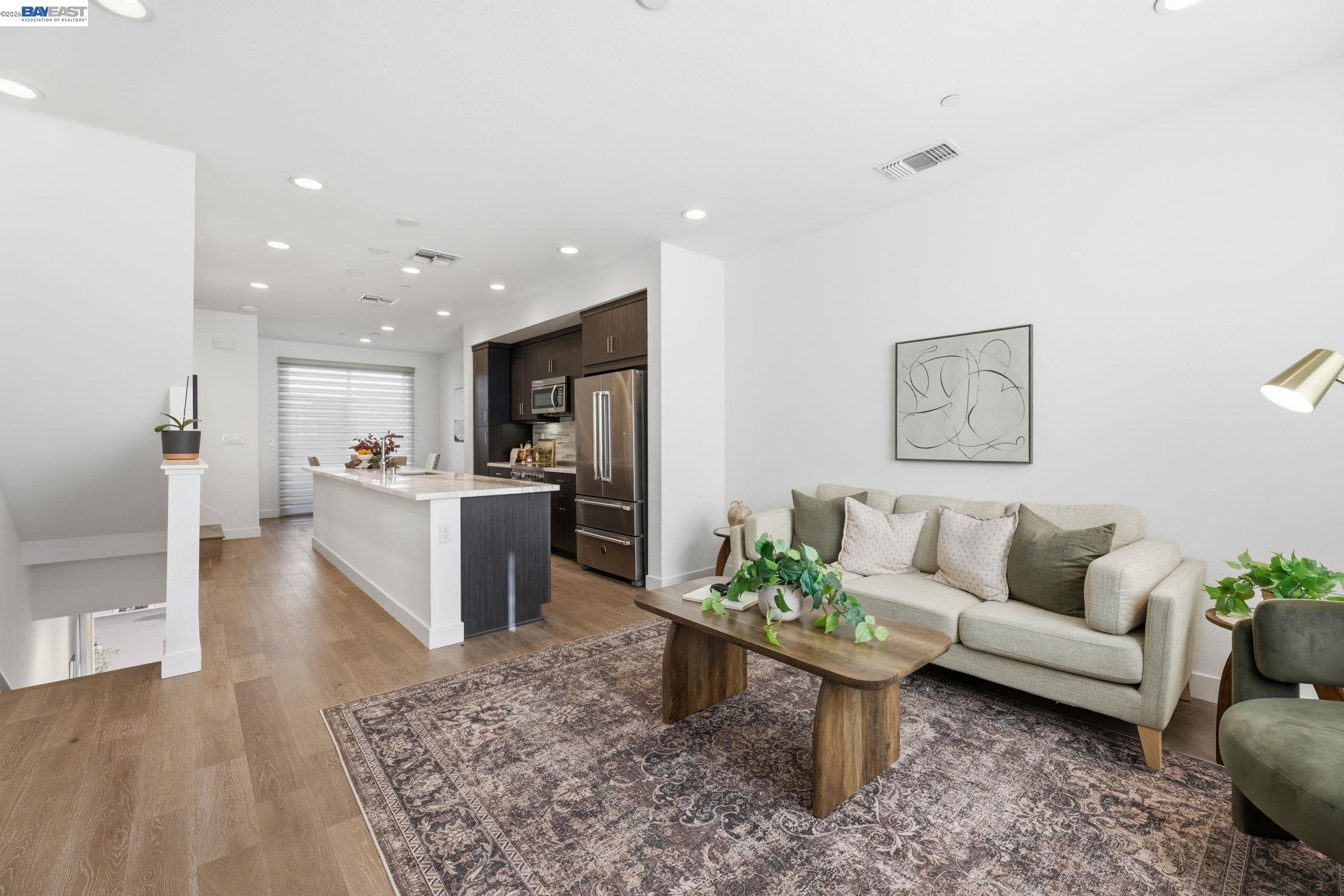 931 Edy Lane Oakland, CA 94607 - Photo 9 of 41 a living room with furniture and kitchen view