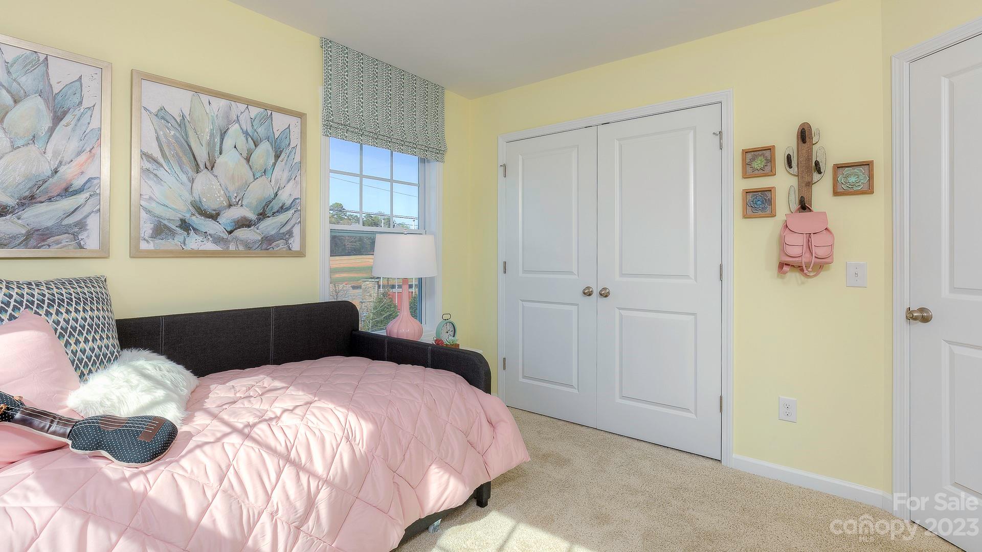 206 Creekview Road Hendersonville, NC 28792 - Photo 31 of 36 a bedroom with a bed and a painting on the wall