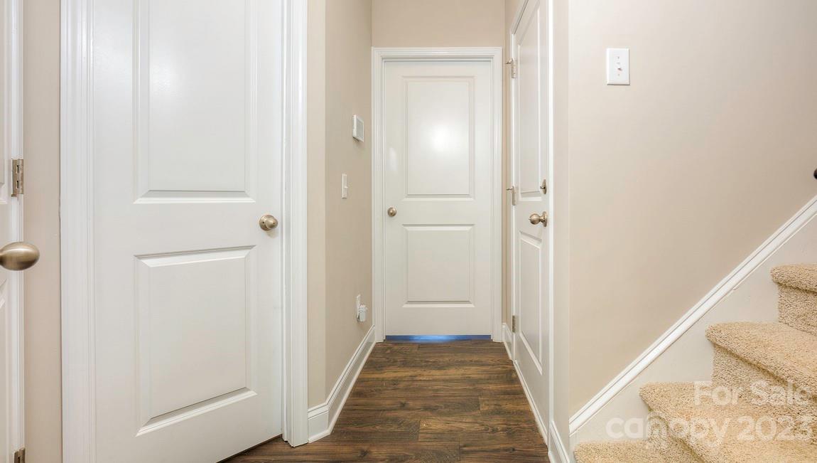 206 Creekview Road Hendersonville, NC 28792 - Photo 4 of 36 a view of a hallway with wooden floor and closet
