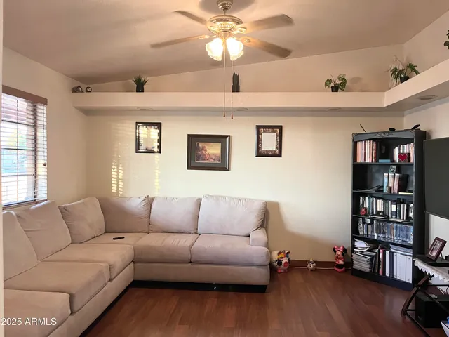 a hallway with a large mirror and vanity