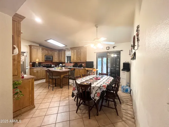 a kitchen with stainless steel appliances a stove a sink and a microwave
