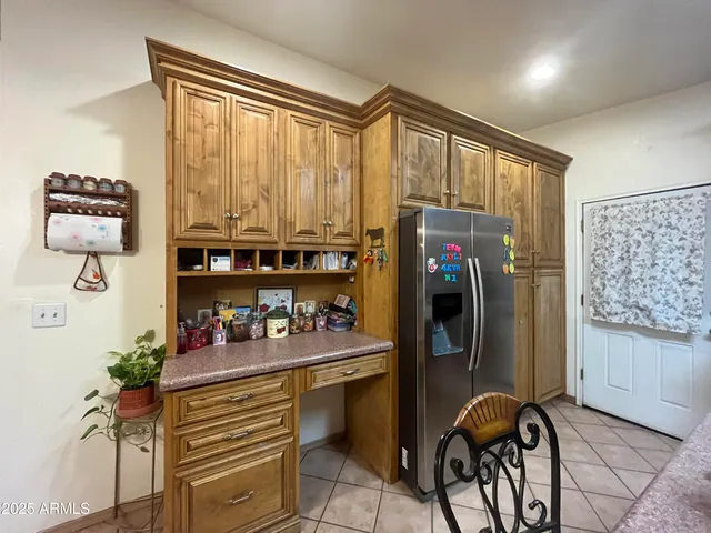 a kitchen with kitchen island granite countertop a stove a sink and a granite counter tops