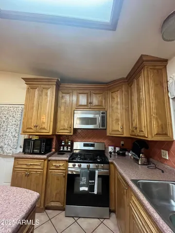 a view of hallway with wooden floor