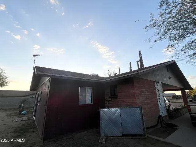 a view of a house with a cars park