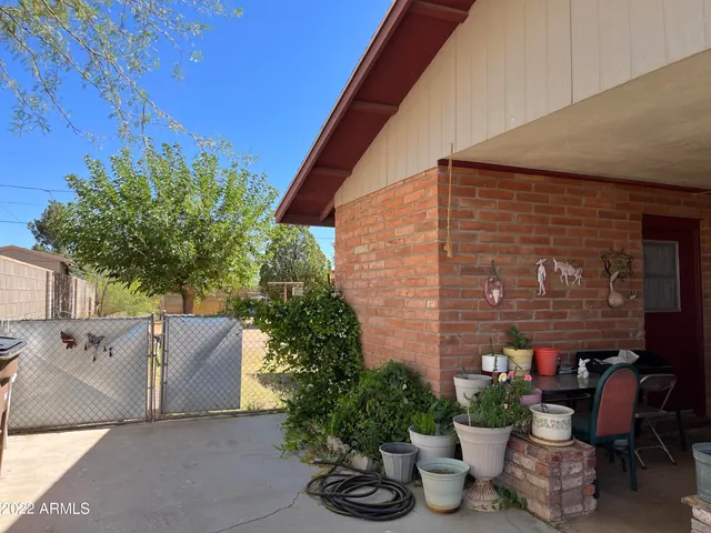 a outdoor living space with furniture and a potted plant