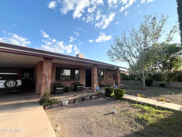 a outdoor living space with patio furniture and potted plants