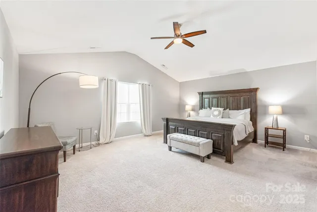 a bedroom with a bed and cabinets