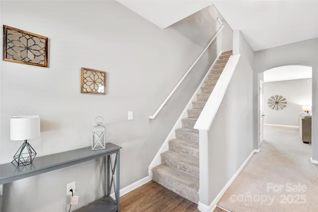 a view of entryway and hall with wooden floor