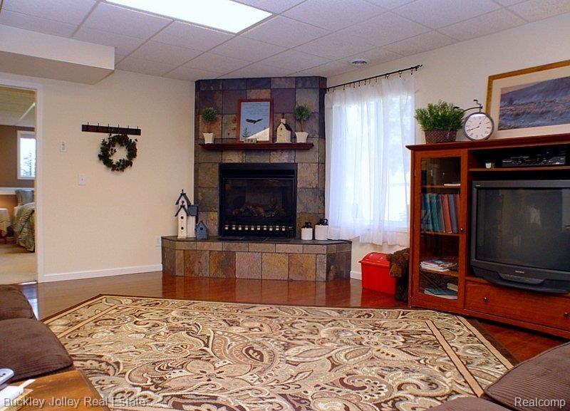 9121 Faussett Road Fenton, MI 48430 - Photo 19 of 25 Tile Fireplace.jpg