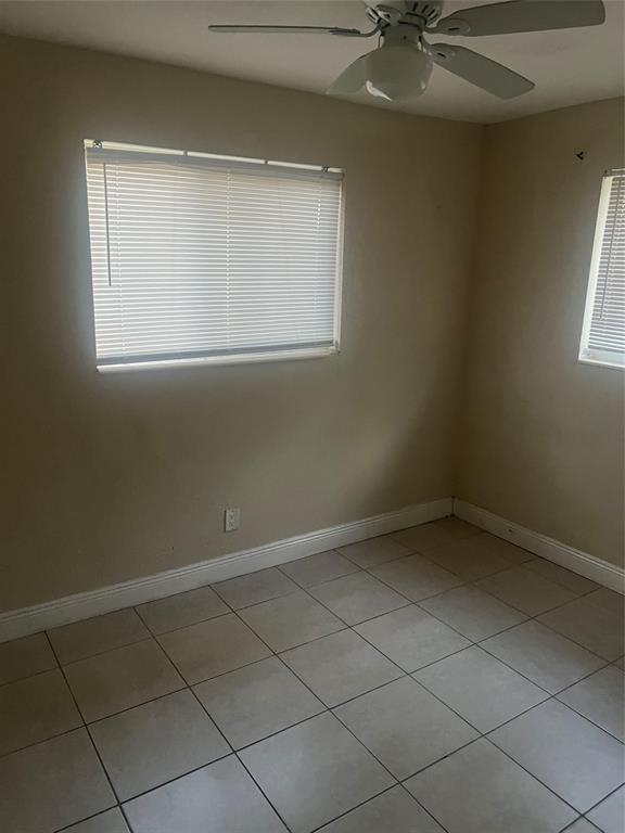 1451 Northwest 33rd Avenue Lauderhill, FL 33311 - Photo 11 of 13 an empty room with a window