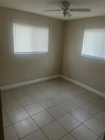 an empty room with a empty space and window