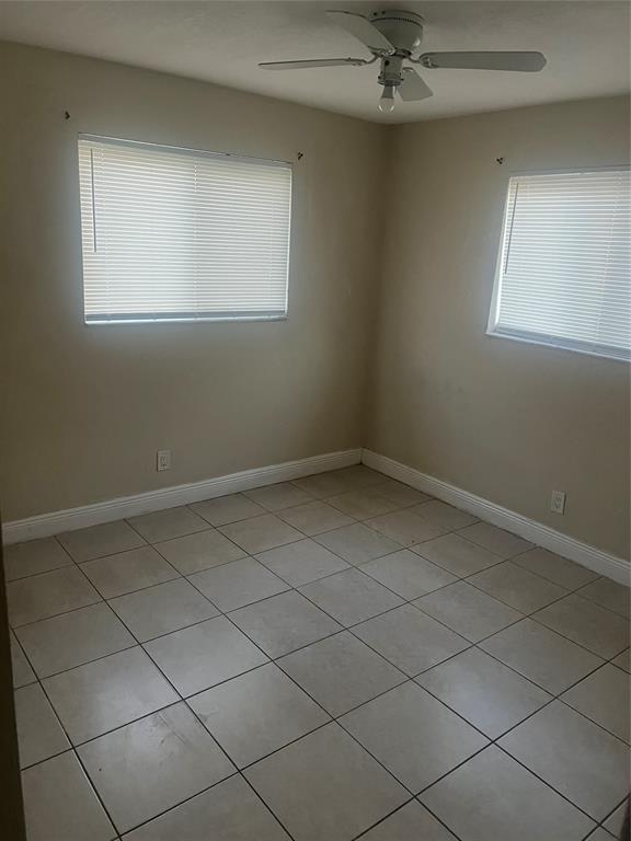 1451 Northwest 33rd Avenue Lauderhill, FL 33311 - Photo 12 of 13 an empty room with a window