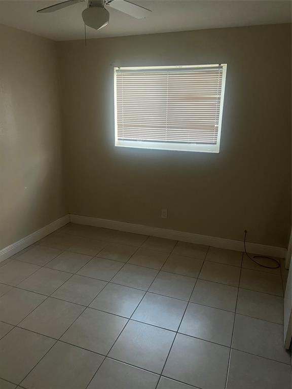 1451 Northwest 33rd Avenue Lauderhill, FL 33311 - Photo 13 of 13 an empty room with a empty space and window