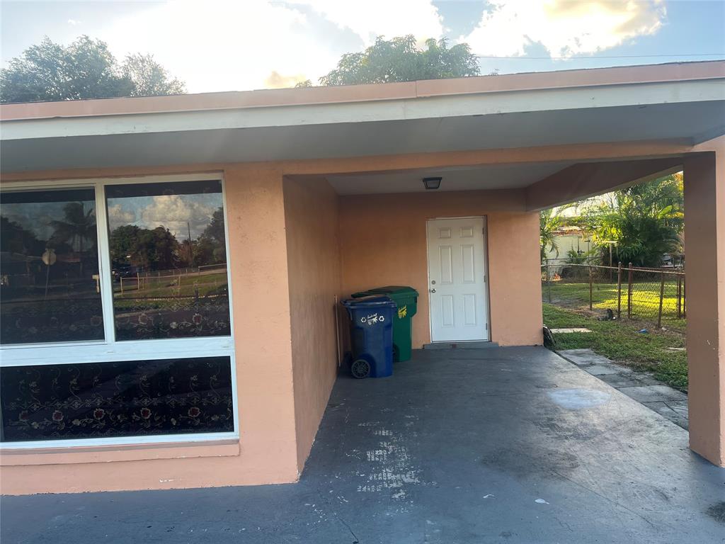 1451 Northwest 33rd Avenue Lauderhill, FL 33311 - Photo 3 of 13 a view of a car garage door