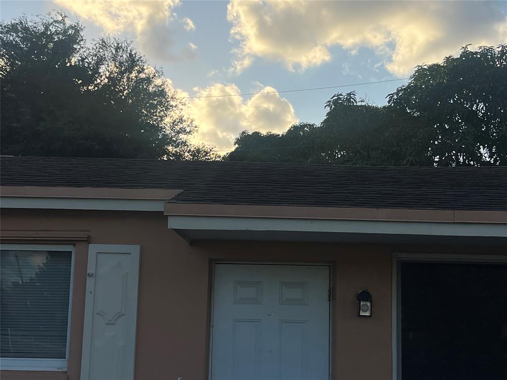 1451 Northwest 33rd Avenue Lauderhill, FL 33311 - Photo 5 of 13 a view of a house with a tree